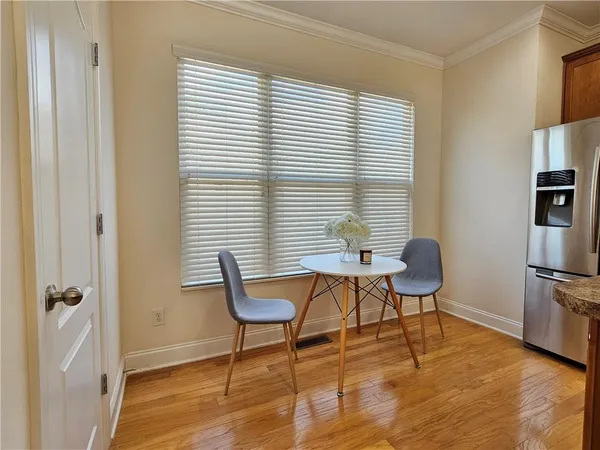 a work room with furniture and wooden floor