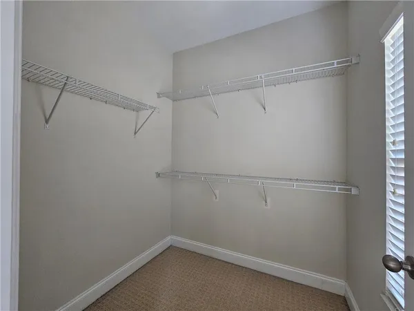 a view of an empty walk in closet
