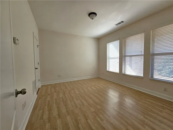 a view of an empty room and a window