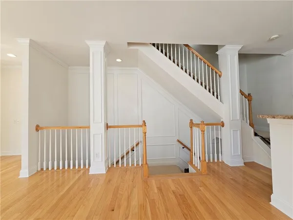 a view of entryway with wooden floor