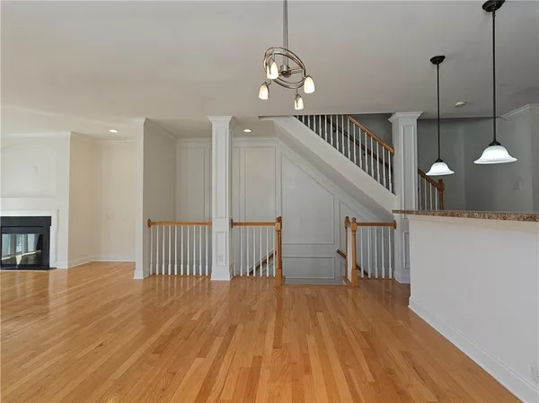 a view of entryway and hall with wooden floor