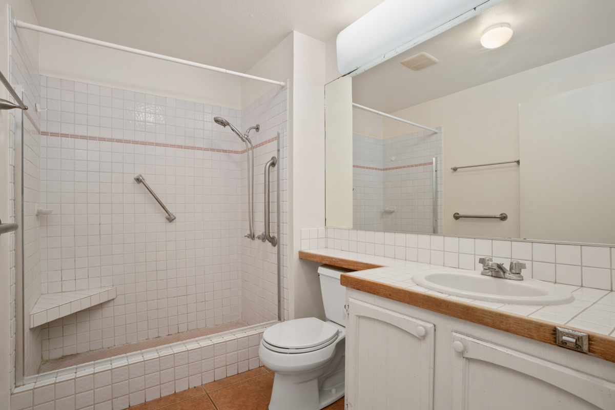3057 Poipu Road, Unit A1 Koloa, HI 96756 - Photo 13 of 19 a bathroom with a sink toilet and shower