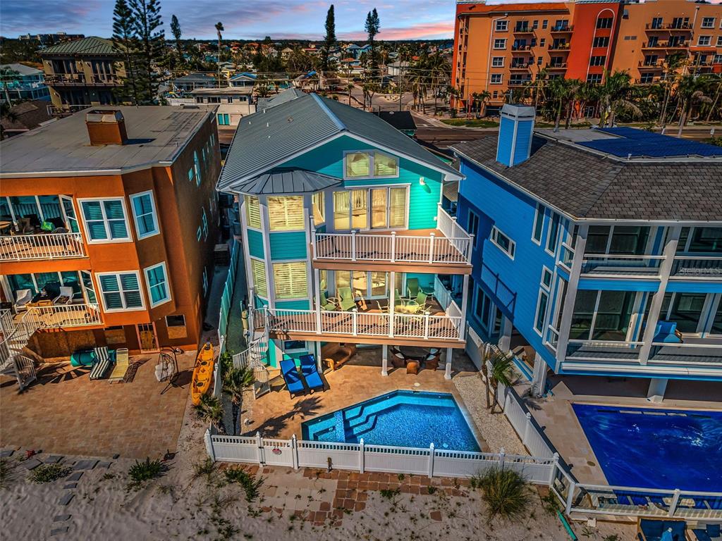 13303 Gulf Lane Madeira Beach, FL 33708 - Photo 40 of 42 an aerial view of a house with a yard