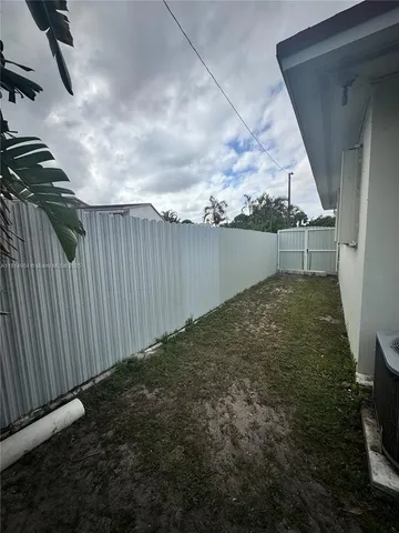 a view of a kitchen with a large window