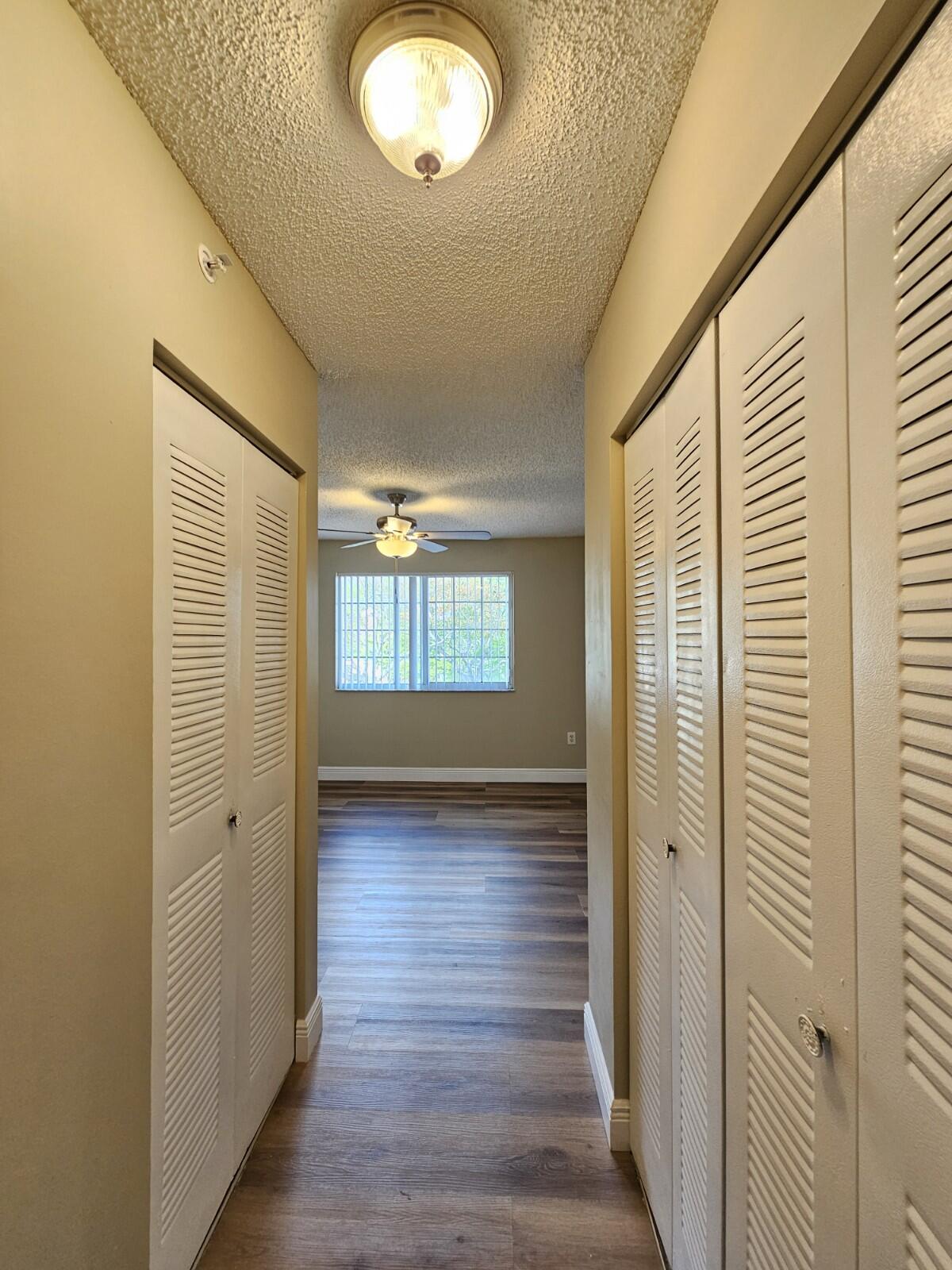 4191 Haverhill Road, Unit 408 West Palm Beach, FL 33417 - Photo 20 of 22 a view of a livingroom with wooden floor