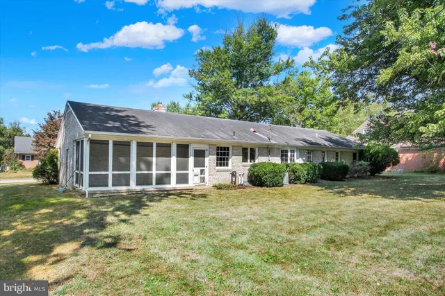 a view of backyard with large trees