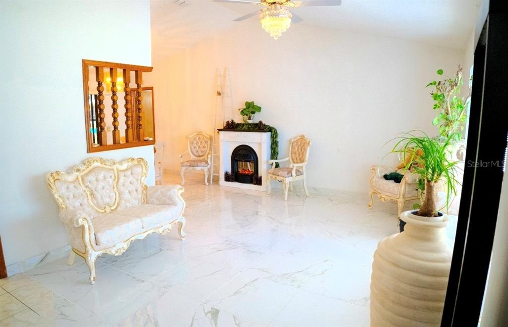4150 South Apopka Avenue Inverness, FL 34452 - Photo 22 of 84 a view of living room with furniture and a chandelier