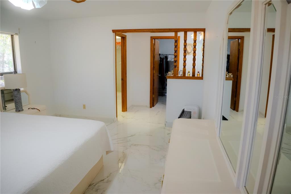 4150 South Apopka Avenue Inverness, FL 34452 - Photo 34 of 84 a bedroom with a bed and a window