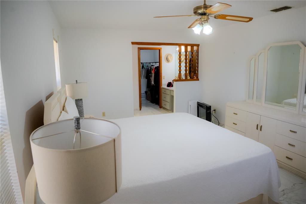 4150 South Apopka Avenue Inverness, FL 34452 - Photo 38 of 84 a bedroom with a bed and a dresser