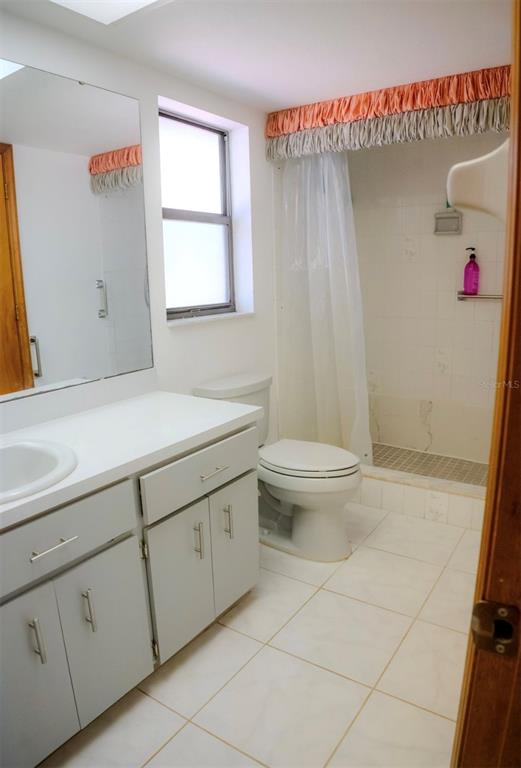 4150 South Apopka Avenue Inverness, FL 34452 - Photo 44 of 84 a bathroom with a sink a toilet and shower