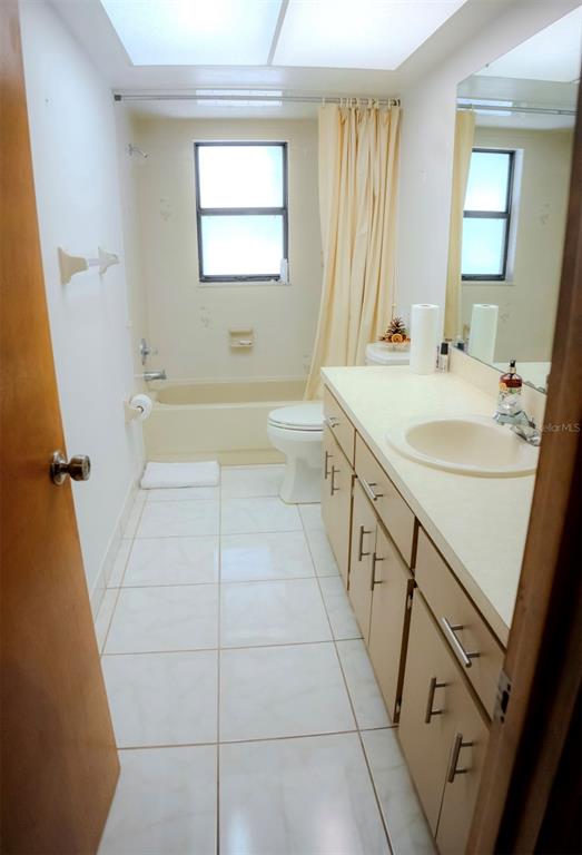 4150 South Apopka Avenue Inverness, FL 34452 - Photo 55 of 84 a bathroom with a sink a toilet a mirror and bathtub