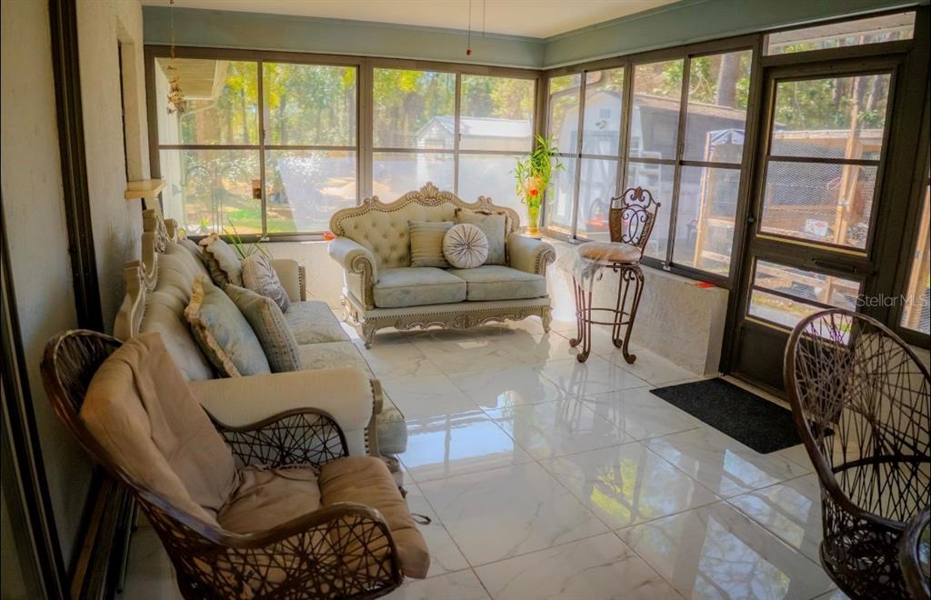 4150 South Apopka Avenue Inverness, FL 34452 - Photo 57 of 84 a living room with furniture and a large window