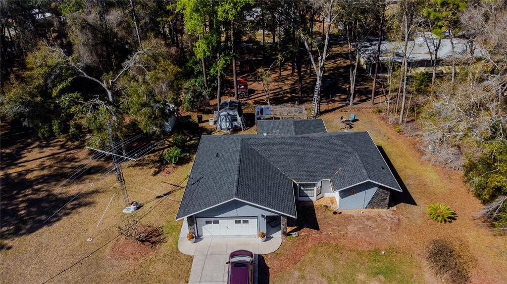 4150 South Apopka Avenue Inverness, FL 34452 - Photo 7 of 84 an aerial view of a house with a yard