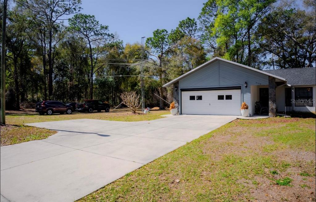 4150 South Apopka Avenue Inverness, FL 34452 - Photo 9 of 84 a front view of house with yard and trees
