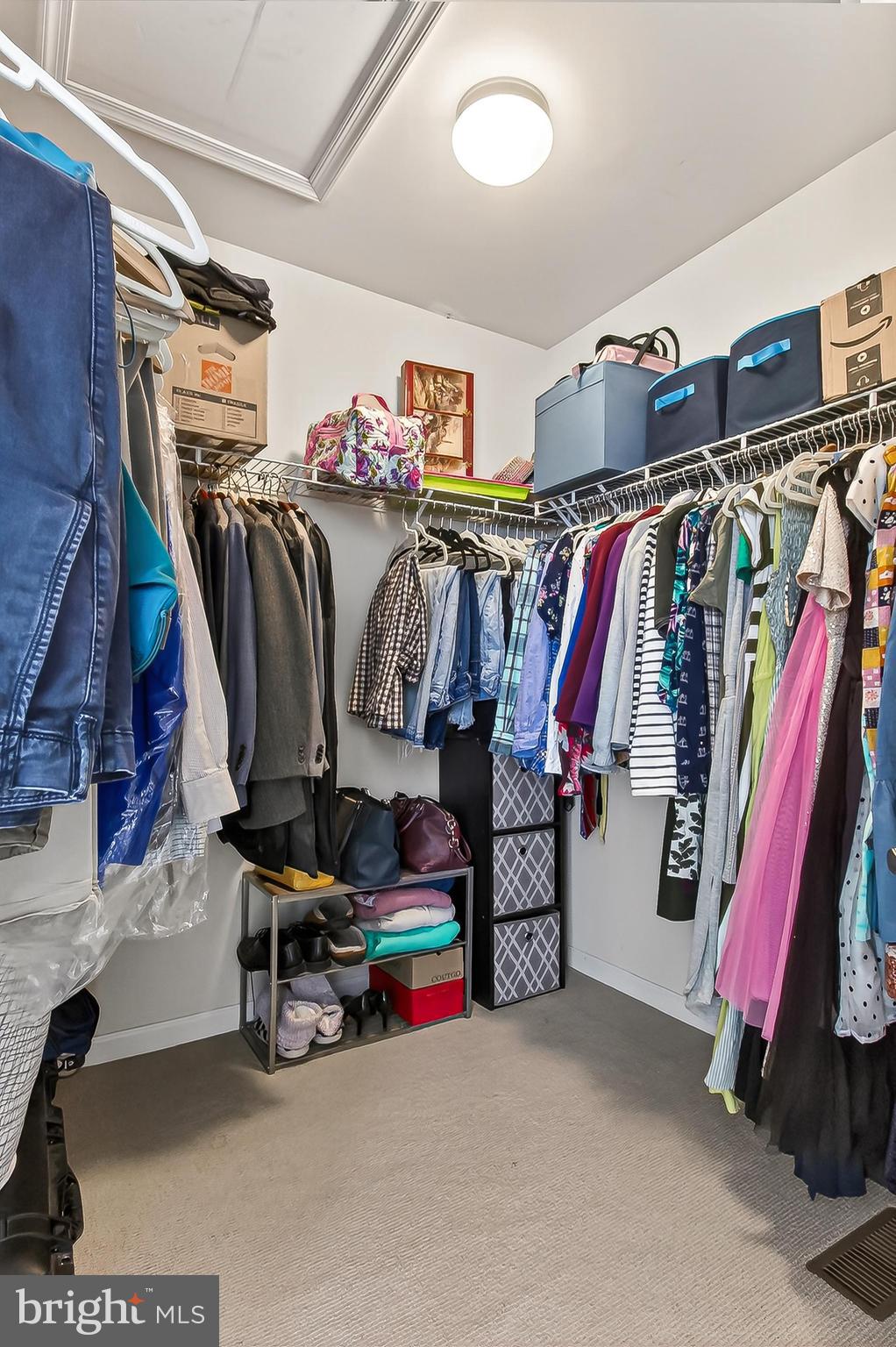 43473 Hopestone Terrace Chantilly, VA 20152 - Photo 30 of 49 a view of walk in closet with clothes and shoes