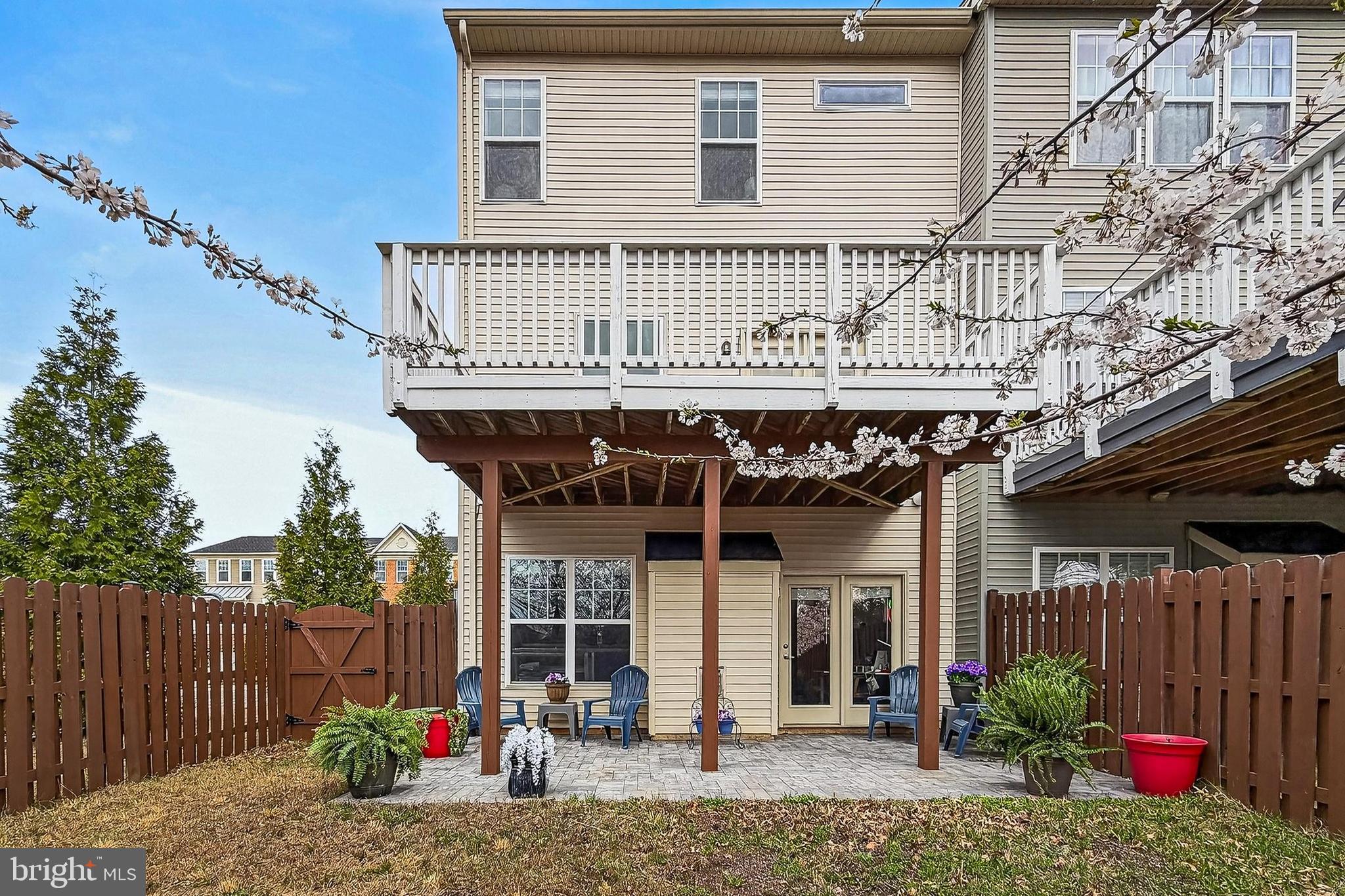 43473 Hopestone Terrace Chantilly, VA 20152 - Photo 48 of 49 a view of a house with a patio and a yard