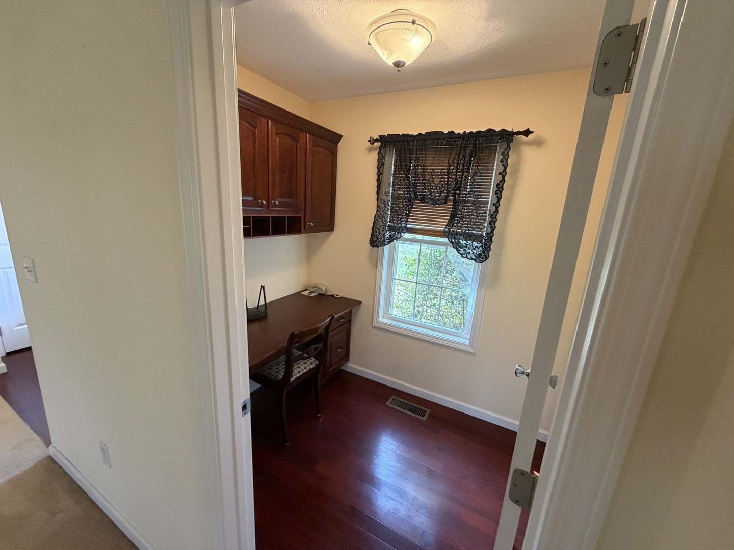 2 Dove Lane Metropolis, IL 62960 - Photo 14 of 35 a view of a hallway and a livingroom with furniture wooden floor and a window