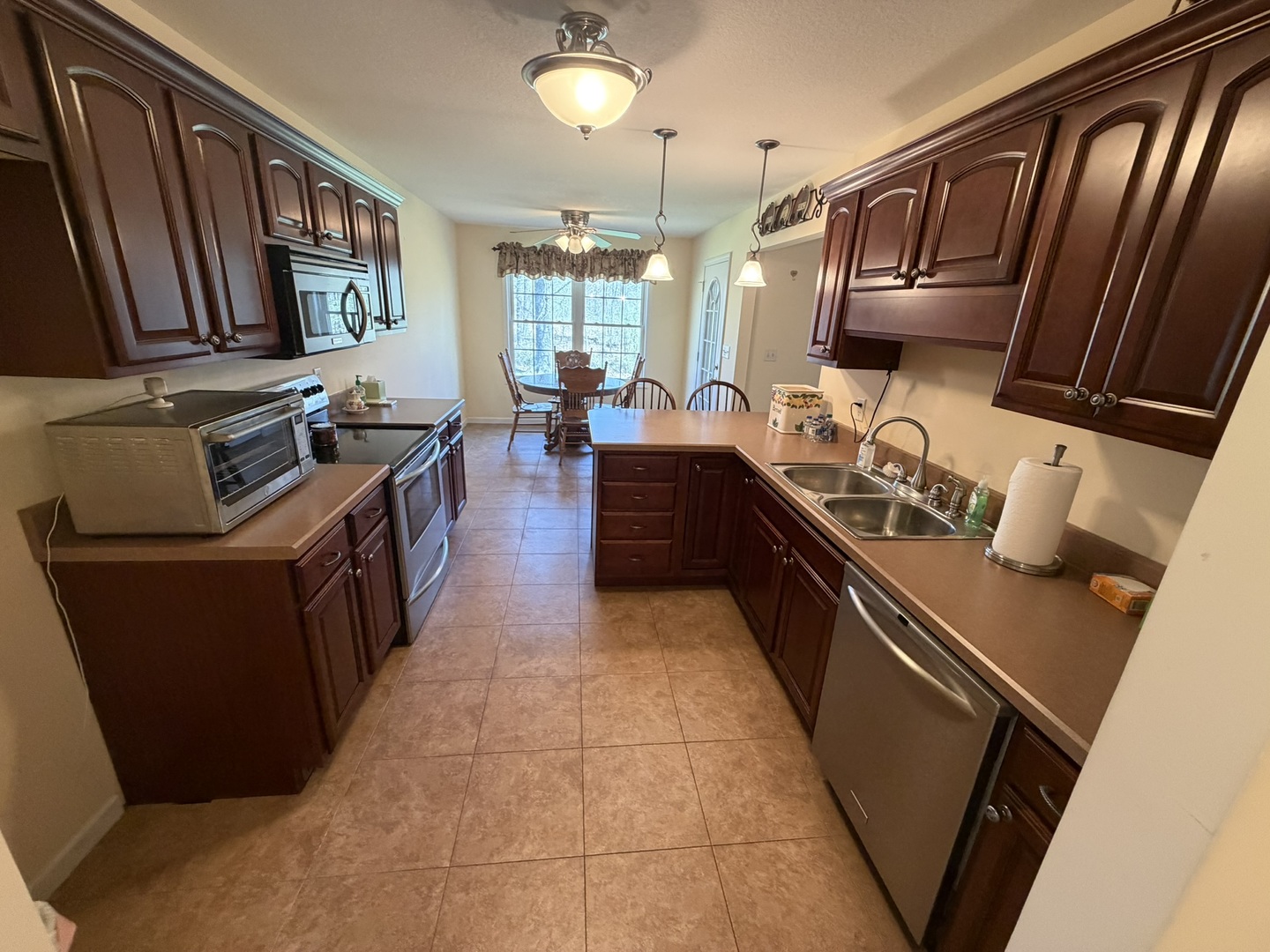 2 Dove Lane Metropolis, IL 62960 - Photo 10 of 35 a kitchen with granite countertop a stove top oven a sink dishwasher and cabinets