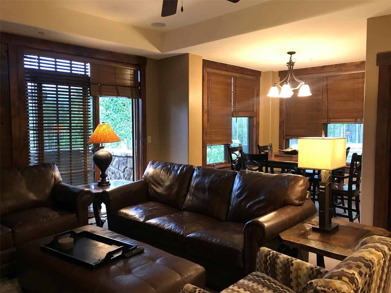 1891 Ski Hill Road, Unit 7000 Breckenridge, CO 80424 - Photo 12 of 25 a living room with furniture and a chandelier