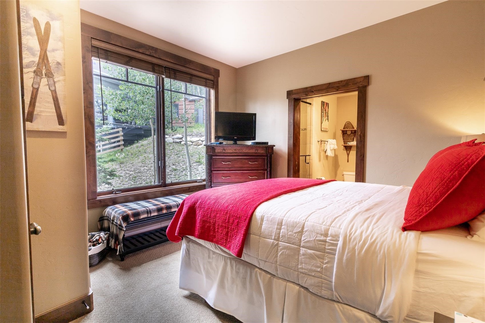 1891 Ski Hill Road, Unit 7000 Breckenridge, CO 80424 - Photo 17 of 25 a bedroom with a bed and a television