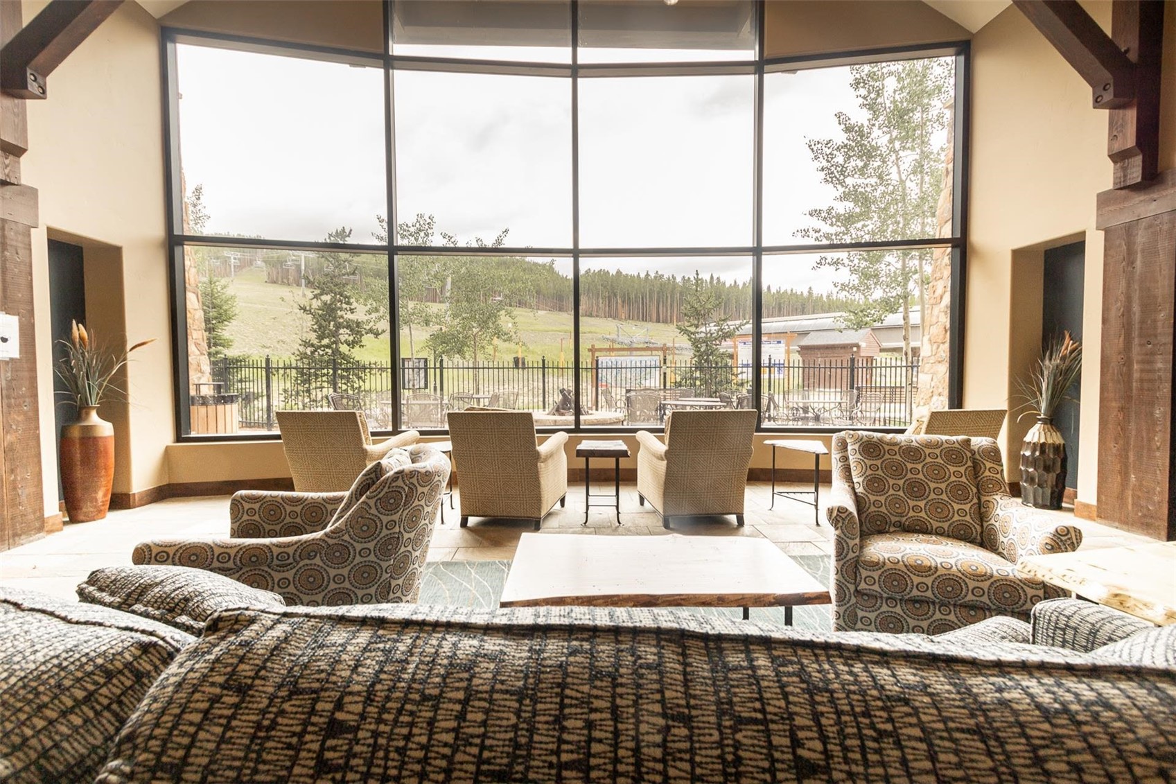 1891 Ski Hill Road, Unit 7000 Breckenridge, CO 80424 - Photo 20 of 25 a living room with large windows