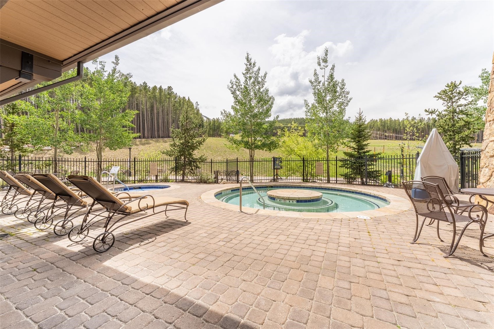 1891 Ski Hill Road, Unit 7000 Breckenridge, CO 80424 - Photo 25 of 25 a view of a swimming pool with a patio