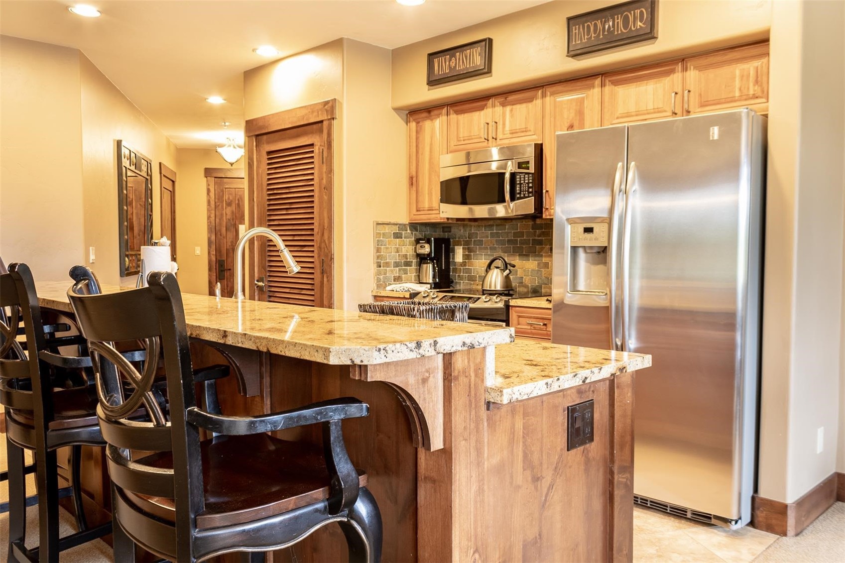 1891 Ski Hill Road, Unit 7000 Breckenridge, CO 80424 - Photo 8 of 25 a kitchen with a sink appliances and cabinets