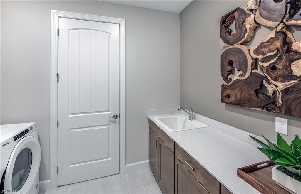 20498 Pebble Gln Drive Estero, FL 33928 - Photo 17 of 46 a bathroom with a sink and a mirror