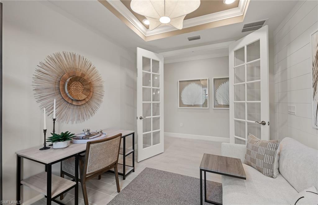 20498 Pebble Gln Drive Estero, FL 33928 - Photo 25 of 46 a living room with furniture and a large window