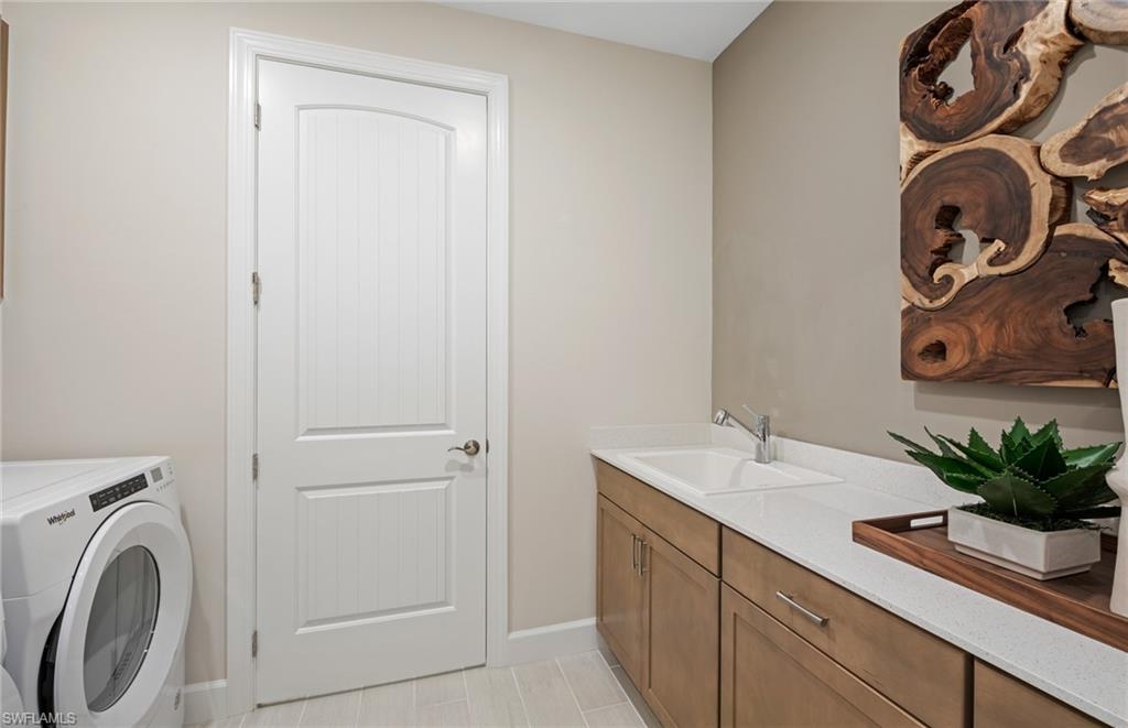 20498 Pebble Gln Drive Estero, FL 33928 - Photo 33 of 46 a bathroom with a sink and a mirror