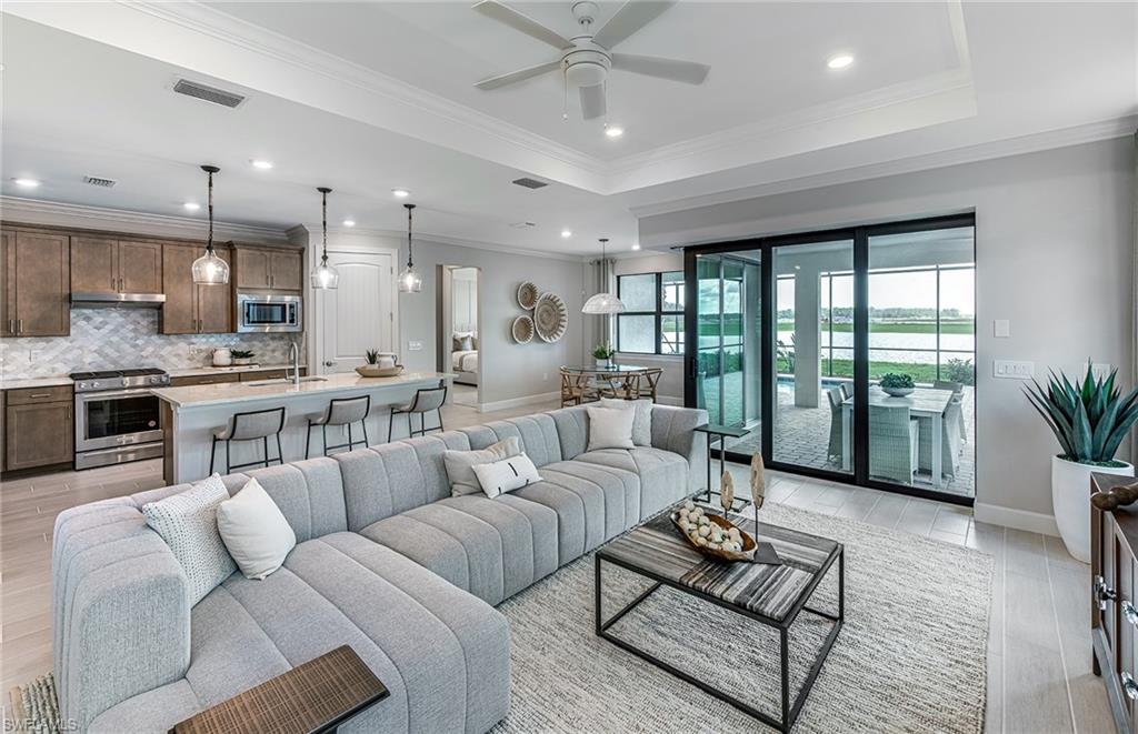 20498 Pebble Gln Drive Estero, FL 33928 - Photo 5 of 46 a living room with furniture and a large window
