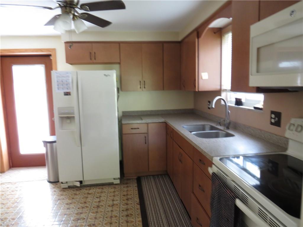 41 Blair Road Eighty Four, PA 15330 - Photo 18 of 33 a kitchen with a refrigerator sink and cabinets