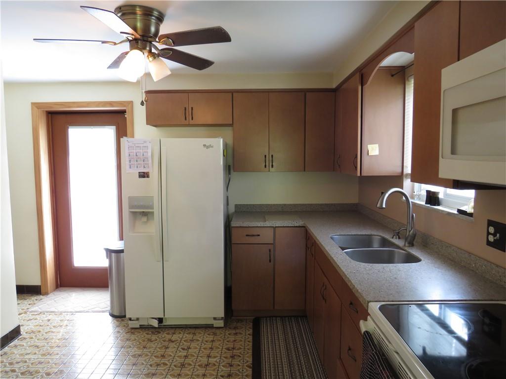 41 Blair Road Eighty Four, PA 15330 - Photo 19 of 33 a kitchen with a refrigerator sink and cabinets