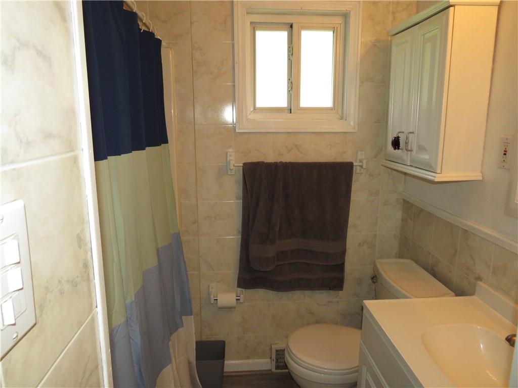 41 Blair Road Eighty Four, PA 15330 - Photo 10 of 33 a bathroom with a toilet and a shower curtain
