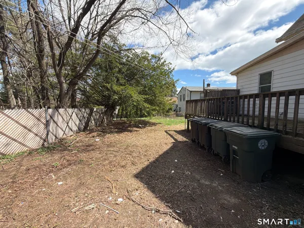 a view of a backyard with a large tree