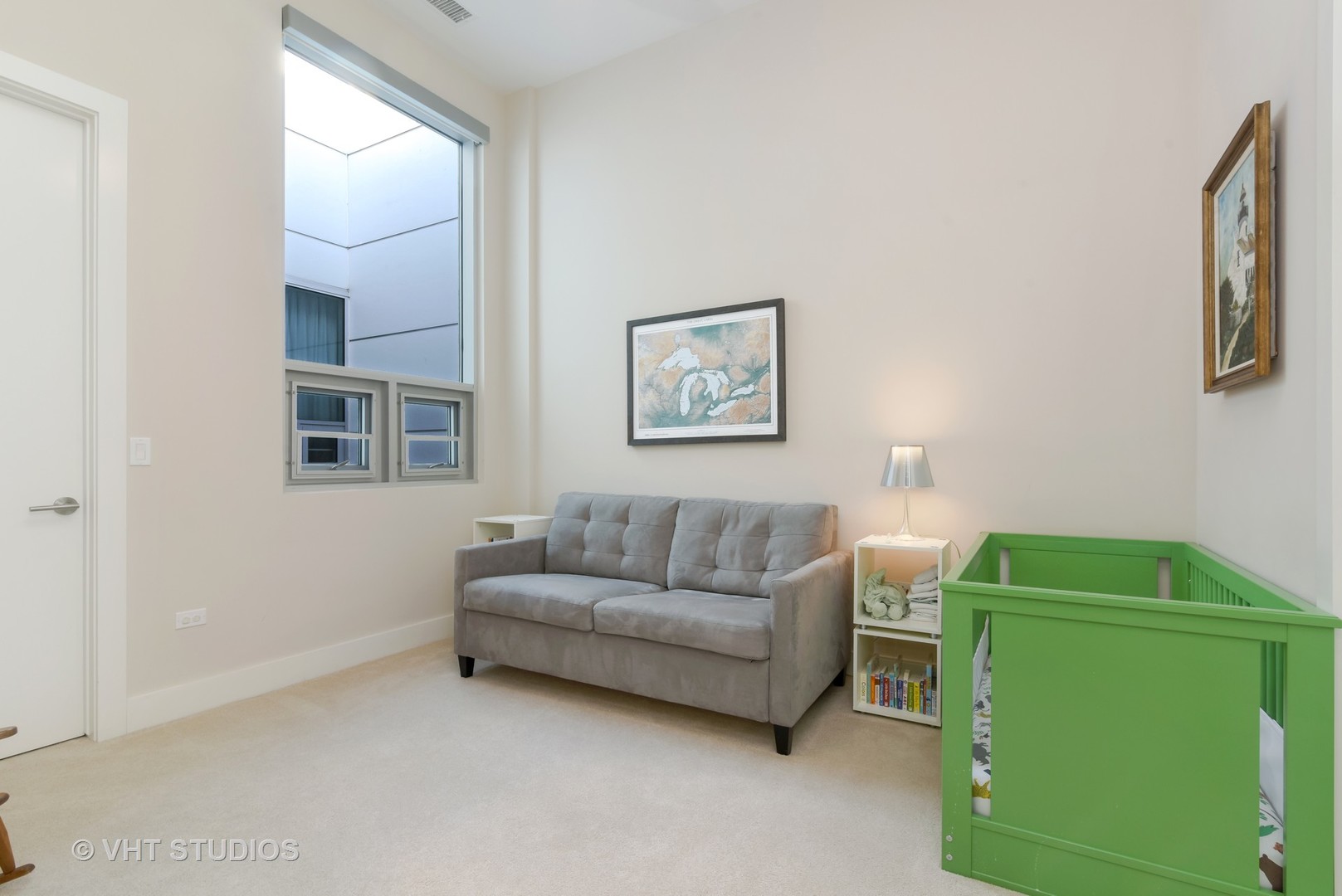 1132 West Adams Street, Unit PHE Chicago, IL 60607 - Photo 13 of 23 a living room with furniture and a baby crib