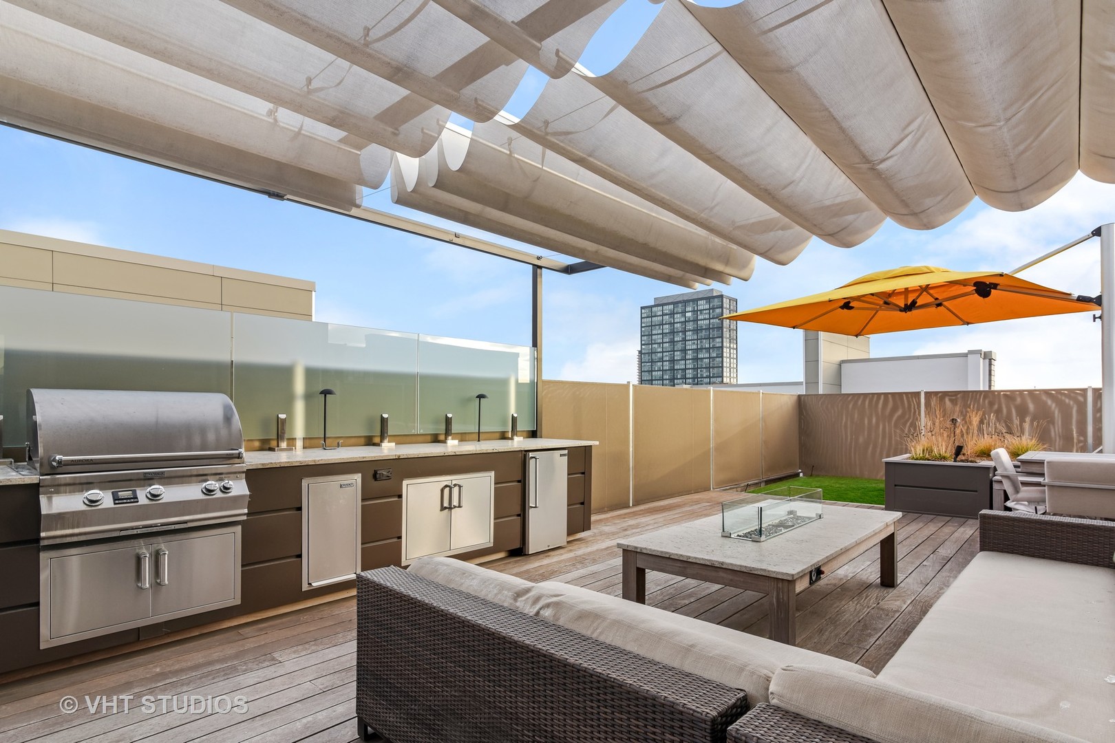 1132 West Adams Street, Unit PHE Chicago, IL 60607 - Photo 20 of 23 a living room with stainless steel appliances kitchen island granite countertop a stove and a sink