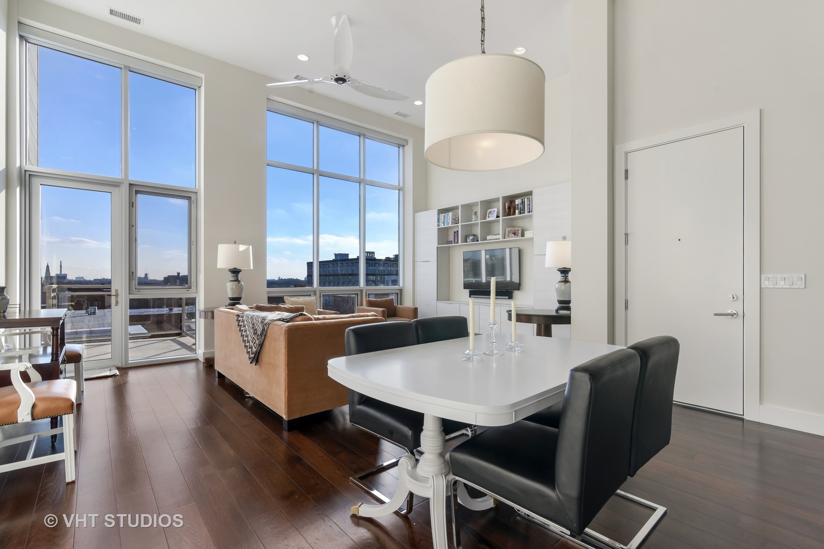 1132 West Adams Street, Unit PHE Chicago, IL 60607 - Photo 5 of 23 a kitchen with a dining table chairs and view living room