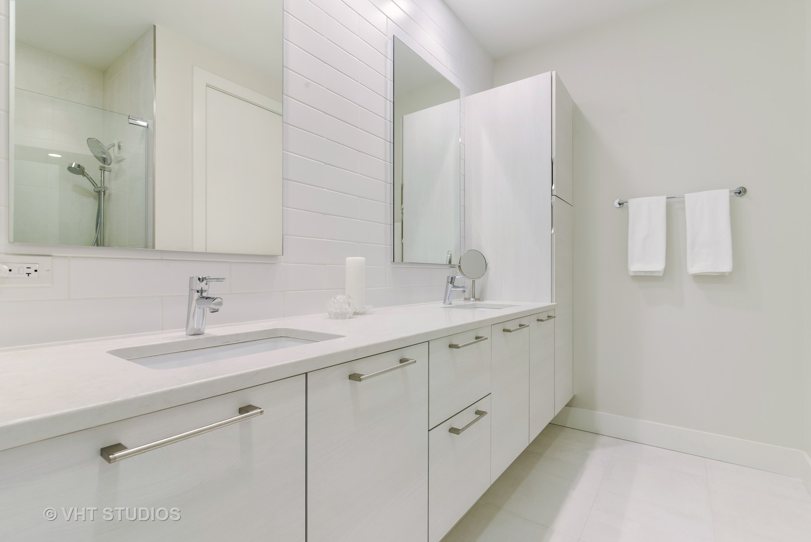 1132 West Adams Street, Unit PHE Chicago, IL 60607 - Photo 9 of 23 a bathroom with a double vanity sink and mirror