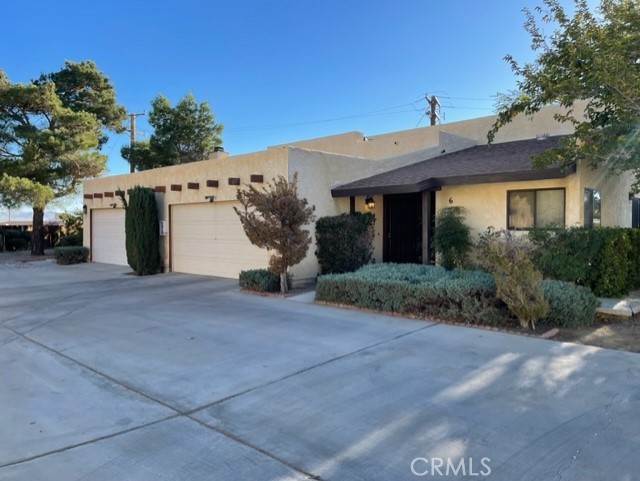 16027 Chehalis Road Apple Valley, CA 92307 - Photo 1 of 1 a view of a house with a yard and garage