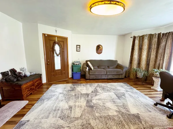 a living room with furniture rug and a fireplace