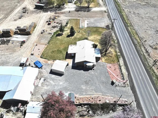 a bathroom with a sink mirror and shower