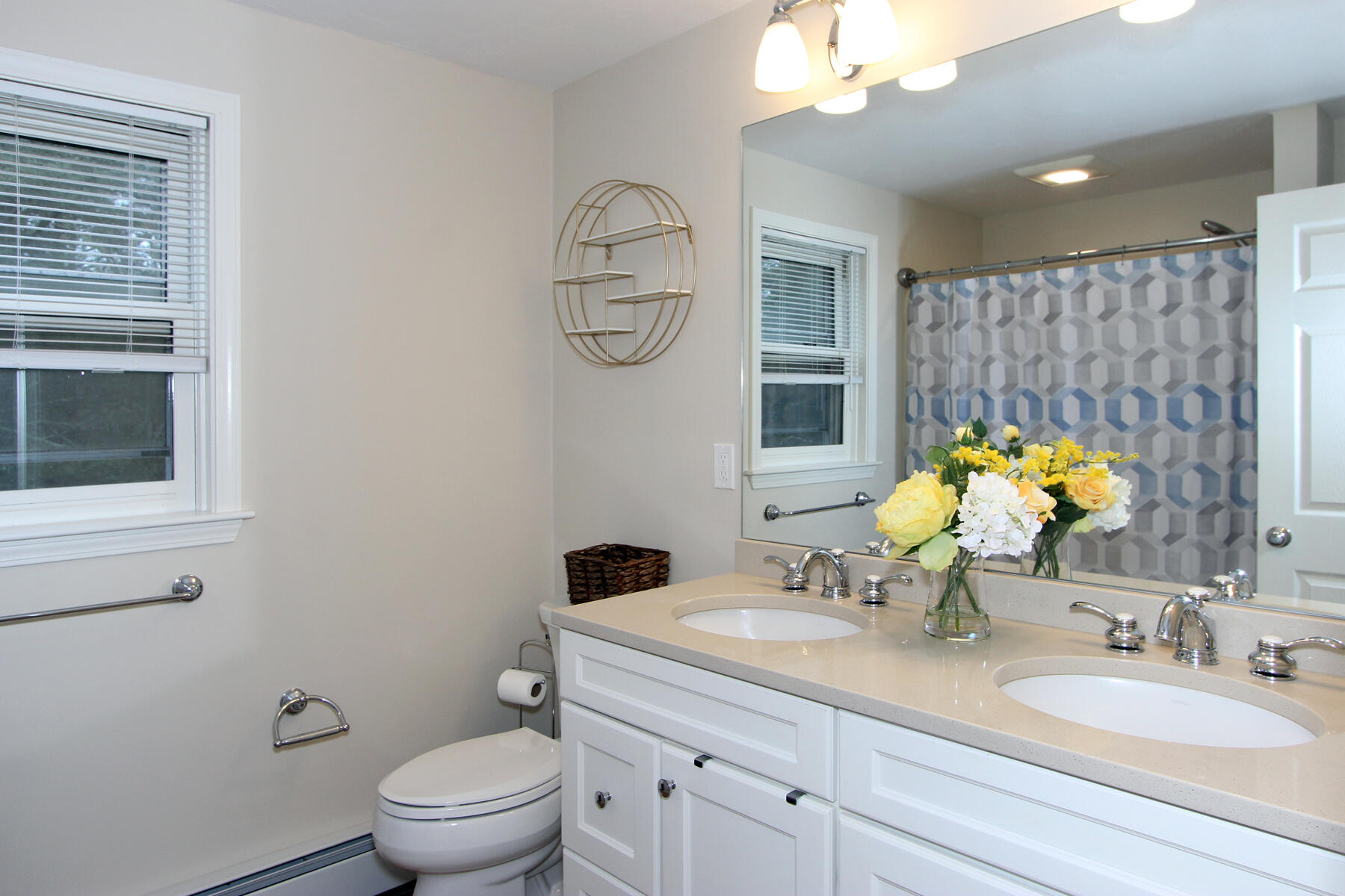 245 Simon Narrows Road Mashpee, MA 02649 - Photo 20 of 38 a bathroom with a granite countertop toilet sink and mirror