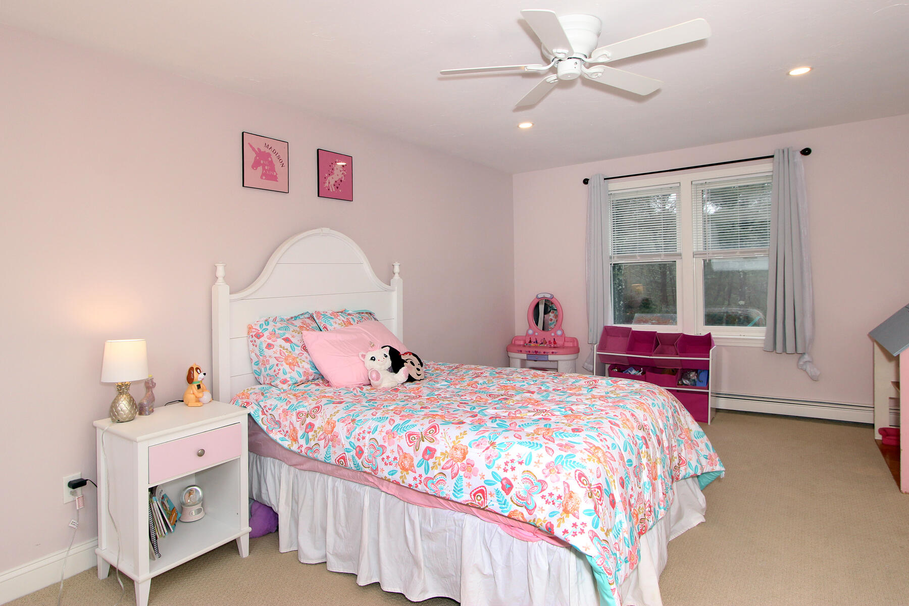 245 Simon Narrows Road Mashpee, MA 02649 - Photo 23 of 38 a bedroom with a bed a chandelier and dresser