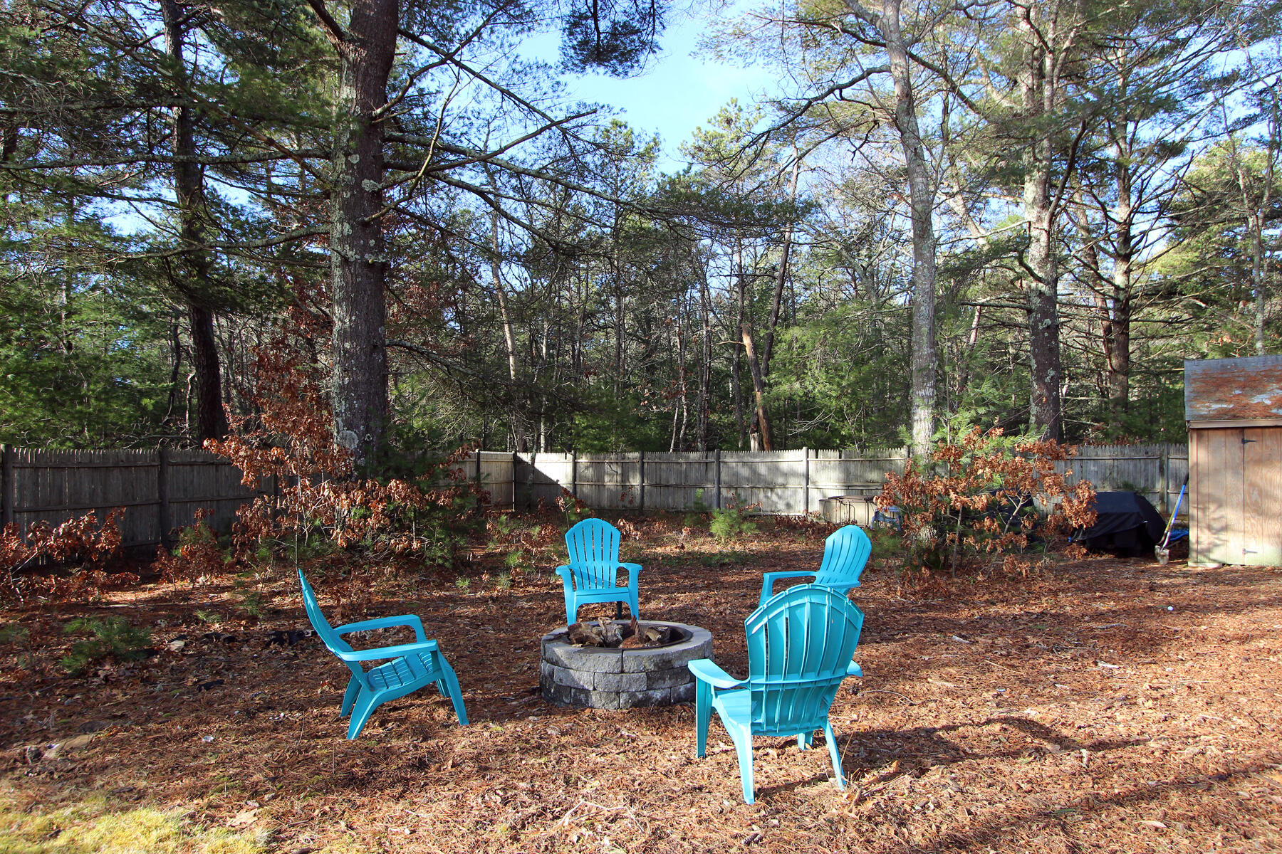 245 Simon Narrows Road Mashpee, MA 02649 - Photo 31 of 38 a view of a chair and table in backyard