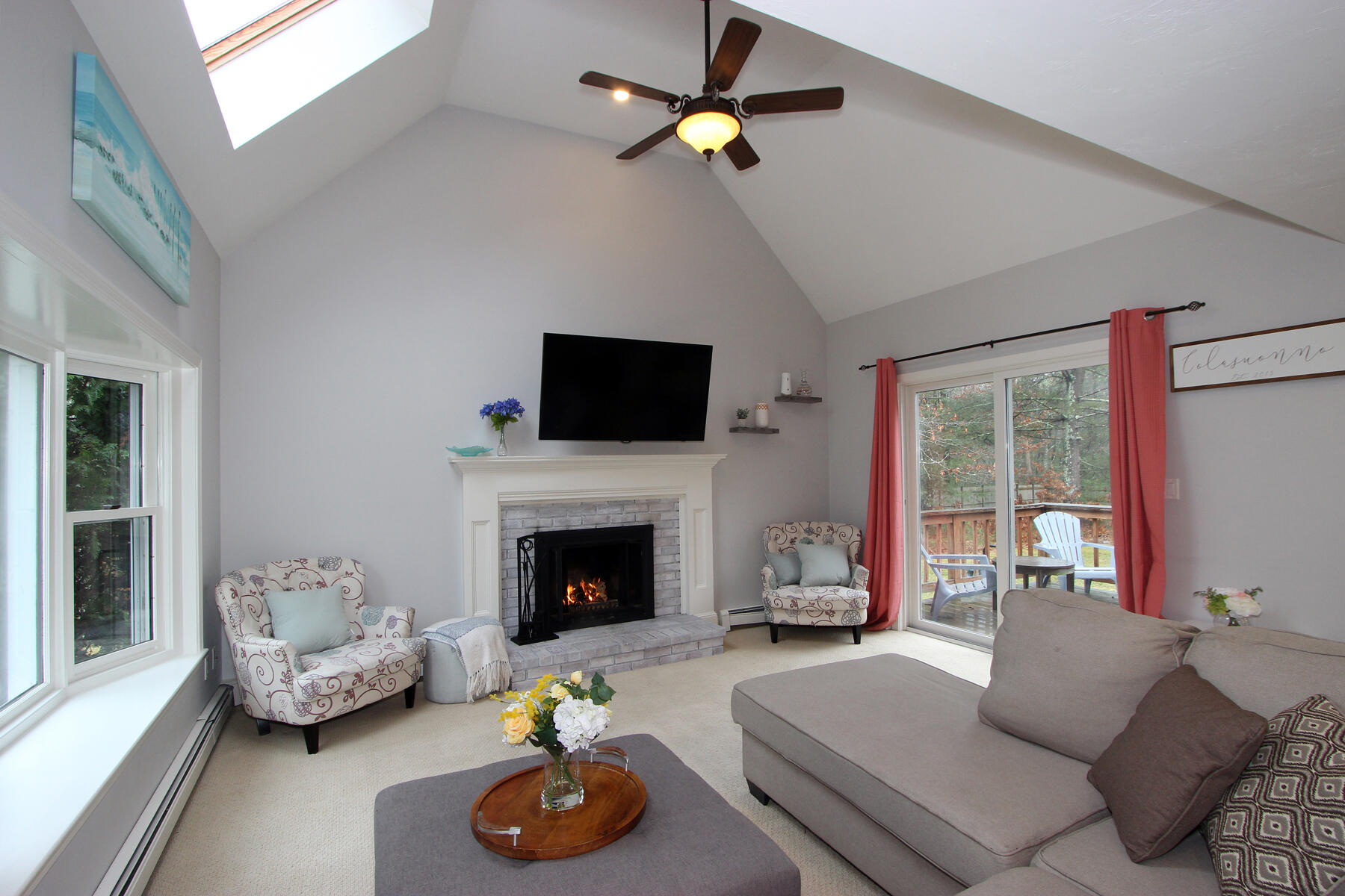 245 Simon Narrows Road Mashpee, MA 02649 - Photo 9 of 38 a living room with furniture and a fireplace