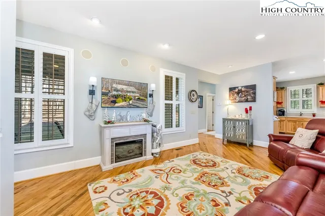 a bedroom with furniture and a fireplace
