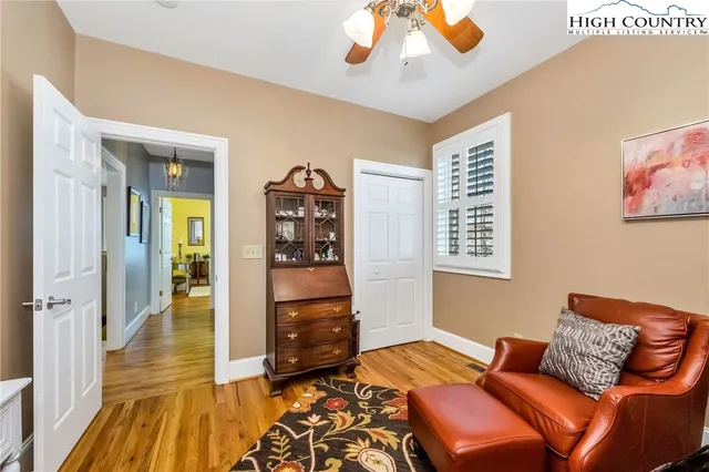 a bedroom with furniture and a window