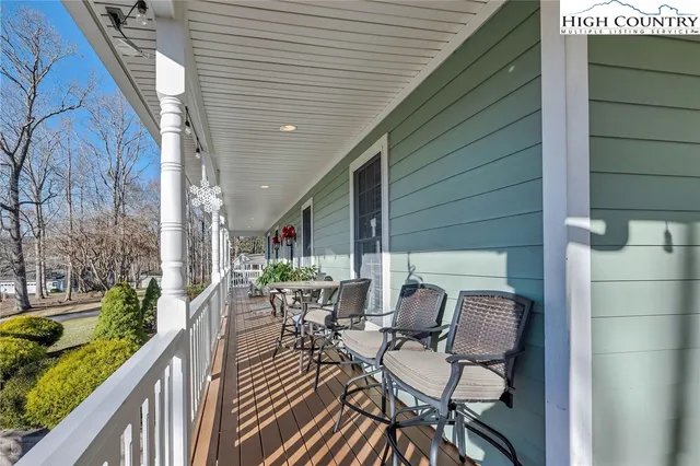 a patio with table and chairs