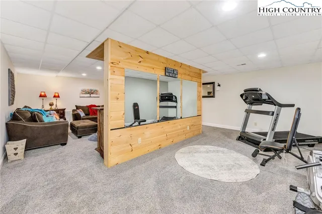 a room with gym equipment and windows